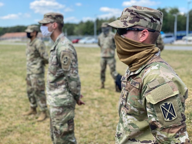 RHINE ORDNANCE BARRACKS, Germany - 2nd Lt. Garrett Julian, support platoon leader assigned to Charlie Battery, 5th Battalion, 7th Air Defense Artillery Regiment listens to opening remarks from Command Sgt. Maj. Gary E. Plotnick, 10th Army Air and...