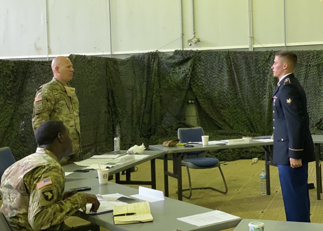 RHINE ORDNANCE BARRACKS, Germany - Spc. Justin Rivard, a team chief assigned to Bravo Battery, 5th Battalion, 4th Air Defense Artillery Regiment at Ansbach, Germany presents himself to the president of the board, 10th Army Air and Missile Defense...