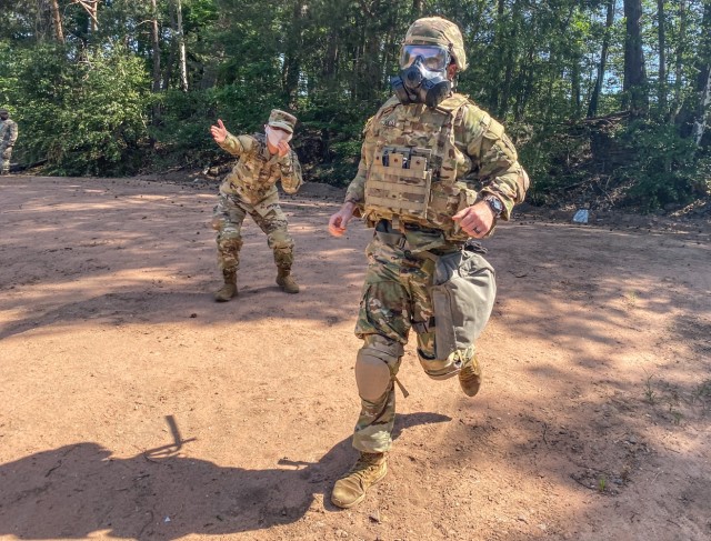 PANZER KASERNE, Germany - 2nd Lt. Garrett Julian, support platoon leader assigned to Charlie Battery, 5th Battalion, 7th Air Defense Artillery Regiment runs through the stress shoot lanes at Panzer Kanserne, Germany June 2. Julian won the officer...
