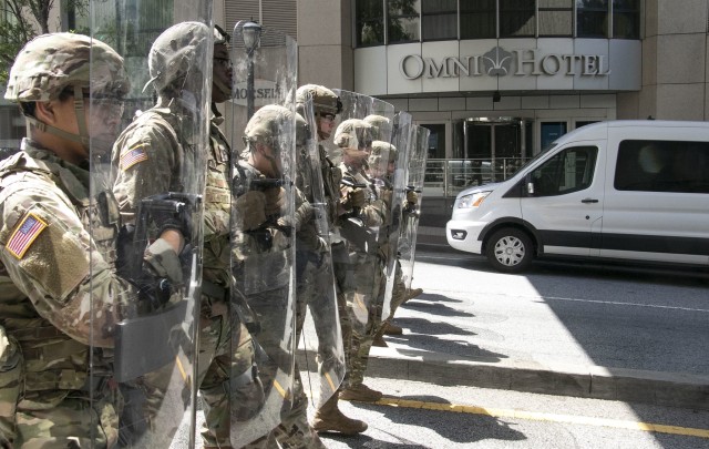 Georgia Army National Guard Soldiers from 1st Squadron, 108th Cavalry Regiment secure a street near Centennial Olympic Park to support Atlanta Police Department officers enforce curfew in Atlanta, June 1, 2020. 