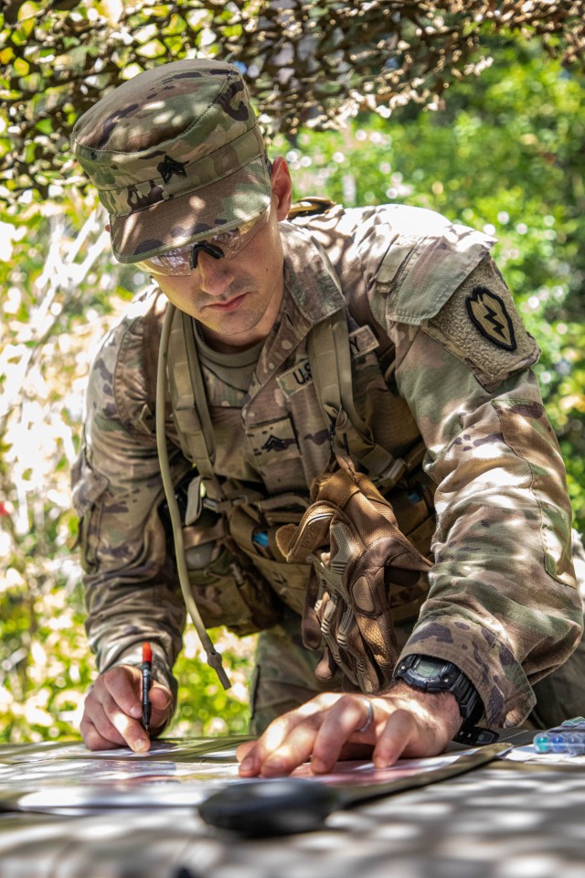 Sgt. Patiellos Faria, an Infantryman with 1st Battalion, 27th Infantry Regiment, 2nd Brigade Combat Team, 25th Infantry Division, plots points on a map as part of Land Navigation during the 25th Inf. Div.&#39;s Best Warrior Competition, on Schofield Barracks, Hawaii, June 2, 2020. Sgt. Faria will be participating in U.S. Army Pacific Best Warrior Competition later this year.