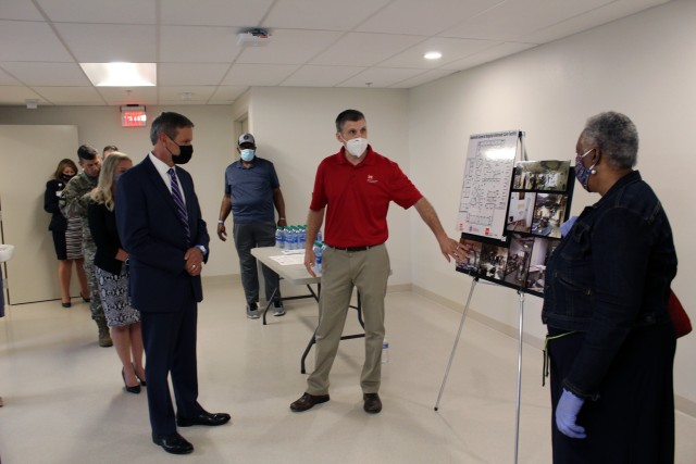(Right to Left) Eric Pagoria, chief of construction, Nashville District Engineering and Construction Branch talks with Gov. Bill Lee, Mayor John Cooper, and other city officials during a tour of the Alternate Care Site construction facility on the...