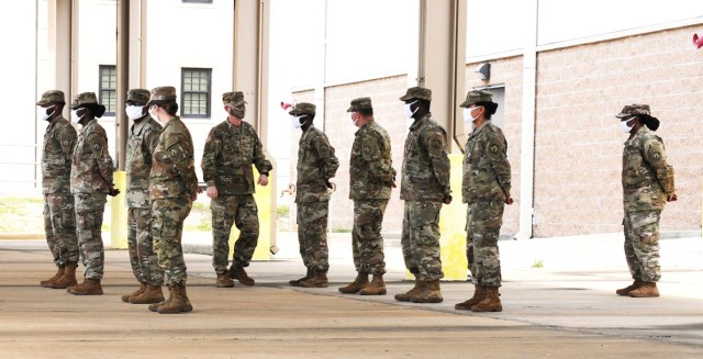 Brig. Gen. Patrick D. Frank, commander, JRTC and Fort Polk, walks through the ranks of the 383rd Modular Movement Control Team, 519th Military Police Battalion, after speaking at their deployment ceremony June 1. The ceremony followed COVID-19...