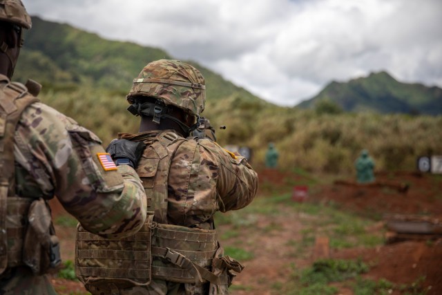 Private Azeon Brown, a Human Resources Specialist with 259 Human Resources Company, Special Troops Battalion, 25th Division Sustainment Brigade, 25th Infantry Division, engages targets during an M17 range held as a part of the Division level...