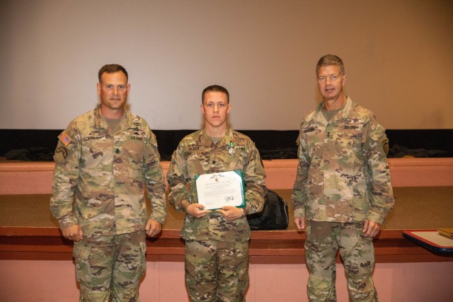 From left to right: 25th Infantry Division Command Sergeant Major, Command Sgt. Maj. William Pouliot, Specialist Brennan Olsen, a Wheeled Vehicle Mechanic with 536 Support Maintenance Company, 524th Combat Sustainment Support Battalion, 25th Division Sustainment Brigade, and 25ID Commanding General, Maj. Gen. James Jarrard pose for a victory photo after announcing the competition winners at Sgt. Smith Theater at Schofield Barracks, HI on June 4, 2020. Spc. Olsen will be participating in U.S. Army Pacific Best Warrior Competition later this year. (U.S. Army photo by Spc. Michael Bradle)