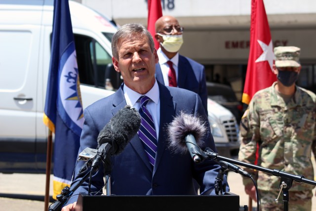 Tennessee Governor Bill Lee talks to attendees during an Alternate Care Site construction turnover ceremony at the Nashville General Hospital project June 5, 2020.
