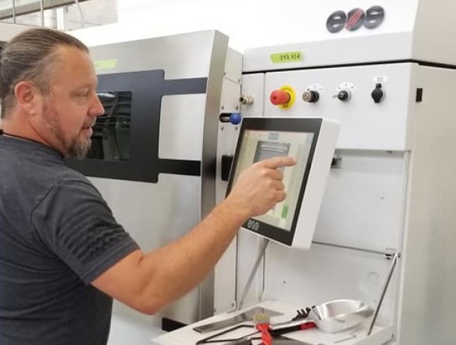 Barrett Craps, additive manufacturing specialist, reviews printer operations last year at the Army&#39;s Advanced and Additive Manufacturing Center of Excellence, Rock Island Arsenal, Alabama. Assistant Secretary of the Army for Acquisition,...