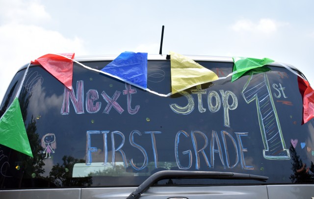 A decorated vehicle celebrates a student’s transition to first grade during an item exchange on the school’s last day at Sagamihara Family Housing Area, Japan, June 8.