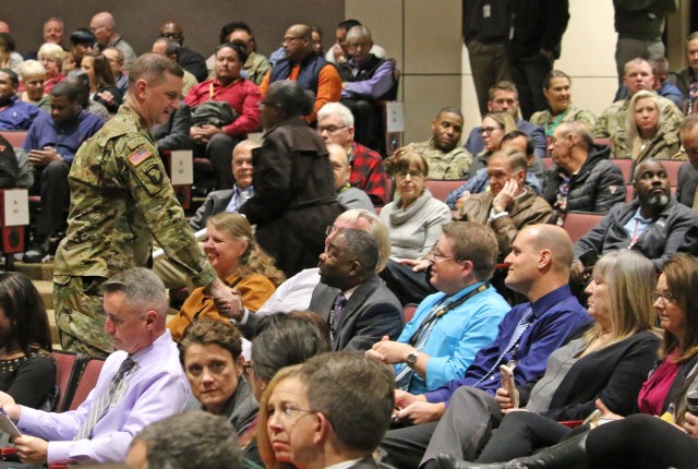 Maj. Gen. Todd Royar, commanding general of the U.S. Army Aviation and Missile Command, greets employees during a Nov. 18, 2019 Town Hall meeting.