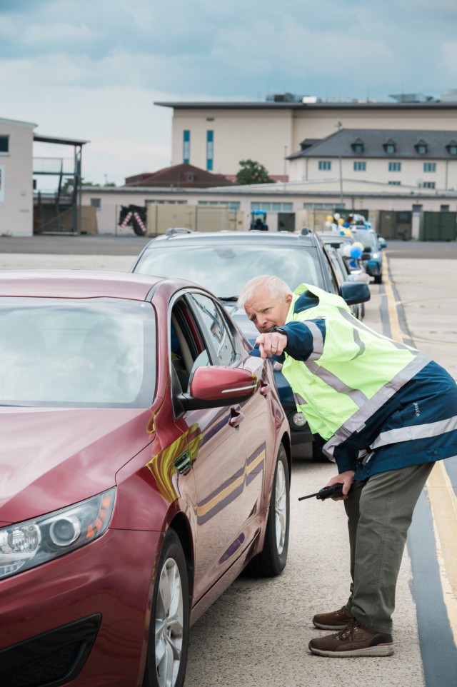 WIESBADEN, Germany - Airfield personnel direct traffic during a graduation celebration June 5, 2020, at U.S. Army Garrison Wiesbaden.