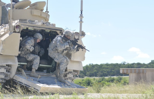 Infantrymen with the 2nd Battalion, 7th Cavalry Regiment exit an M2A3 Bradley Fighting Vehicle to clear a building at Fort Hood, Texas. The Soldiers were testing a new concept in 2015 where cameras mounted outside of the vehicle showed live feeds on tablets in the back of the vehicle.  The Army&#39;s Bradley&#39;s have undergone a number of upgrades over the years.