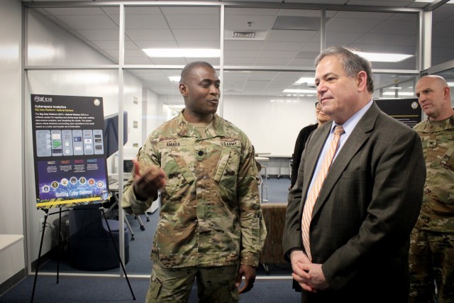 Lt. Col. Peter Amara from Defensive Cyber Operations (DCO) discusses with Jeffrey White, Principal Deputy Assistant Secretary of the Army for Acquisition, Logistics and Technology our rapid acquisition success with the Army’s Big Data Platform,...