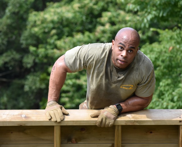 Chief Warrant Officer 2 Keon Ellison, assigned to the 38th Air Defense Artillery Brigade, clears an obstacle while competing in the U.S. Army Japan 2020 Army Week Functional Fitness Team Competition at Camp Zama, Japan, June 9.