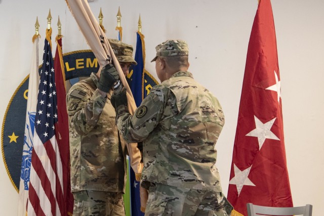 U.S. Army Gen. Stephen J. Townsend, commander of U.S. Africa Command, passes the command guidon to U.S. Army Maj. Gen. Lapthe C. Flora, incoming commander of Combined Joint Task Force-Horn of Africa (CJTF-HOA), during a socially distanced change of command ceremony, June 8, 2020, at Camp Lemonnier, Djibouti. Flora previously served as the U.S. Army Africa deputy commanding general. (U.S. Air Force photo by Tech. Sgt. Ashley Nicole Taylor)