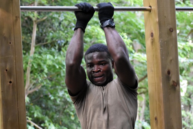Sgt. Kodjo Adoukonou, assigned to the 78th Signal Battalion, gets ready to do one more leg tuck during the U.S. Army Japan 2020 Army Week Functional Fitness Team Competition at Camp Zama, Japan, June 9.