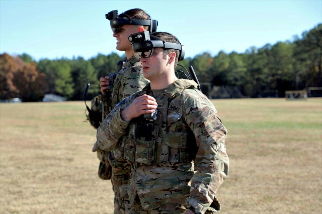Soldiers don the Integrated Visual Augmentation System (IVAS) Capability Set 2 (CS 2) Heads Up Display (HUD) at Soldier Touchpoint 2 (STP 2) in November 2019 at Fort Pickett, Va.