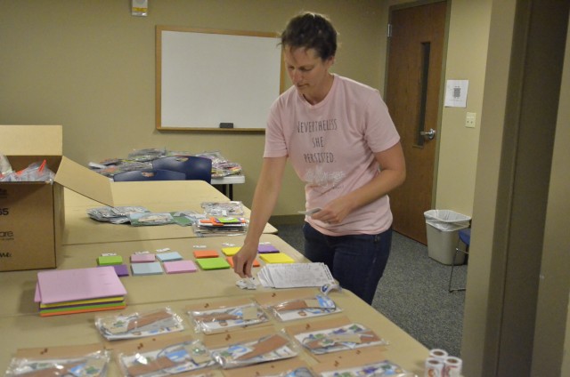 Kristin Rykken, volunteer, helps put together the craft and activity kits for Fort Campbell Religious Support Services Vacation Bible School 2020 program “Tell Me a Story” June 9 at Liberty Chapel. The kits were created specifically to fit the...