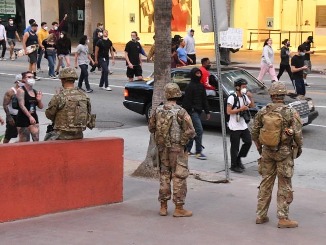 Cal Guard Soldiers from B Company, 1st Battalion, 160th Infantry Regiment support law enforcement in protecting lives and property during protests in downtown Los Angeles on May 31, 2020. (Photo by Capt. Jason Sweeney, California National Guard)