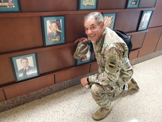 Gen. Michael X. Garrett, FORSCOM Commanding General, with his father's command photo at Fort Stewart, Ga.