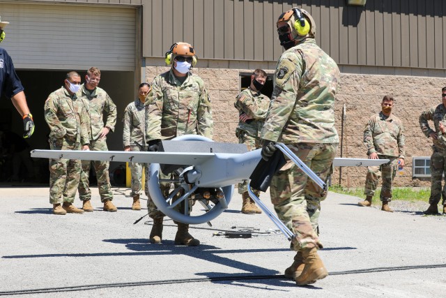 Private First Class Anthony Joanow and Sgt. 1st Class Daniel McEwen, unmanned aerial surveillance maintainers with D Company, 39th Brigade Engineer Battalion, 2nd Brigade Combat Team, 101st Airborne Division (Air Assault), prepare to launch the...