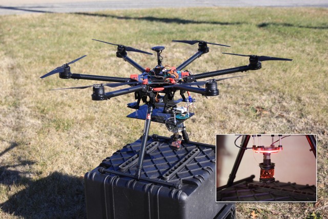 An unmanned aircraft system sports  both a marker strobe (inset) and a traditional survey prism used to evaluate the accuracy of the motion-capture system. 