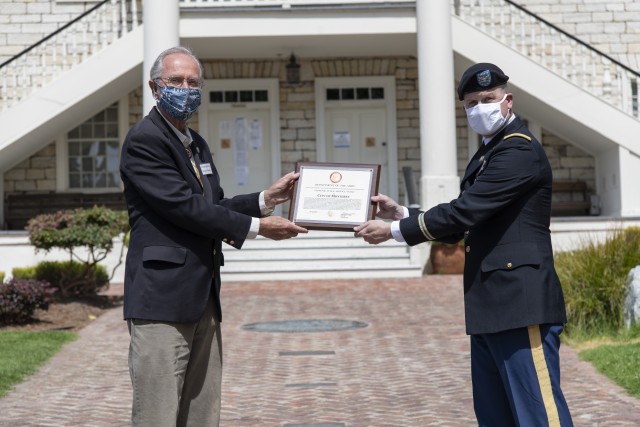 Col. Greg Ford, Presidio of Monterey commander, presents Mayor Clyde Roberson, City of Monterey, with a Patriotic Public Service Award to the City of Monterey for 250 years of partnership on June 8 at the Colton Hall Museum.