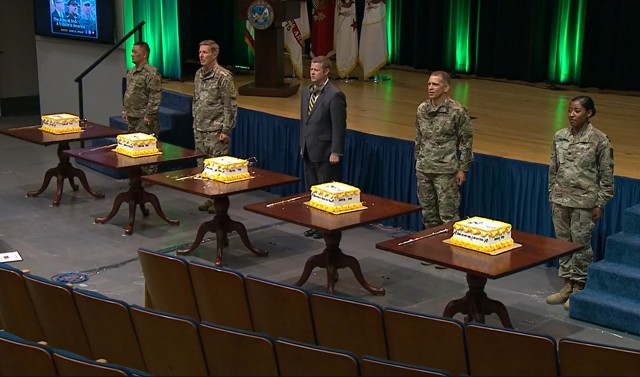 Army Chief of Staff Gen. James C. McConville, second from left; Army Secretary Ryan D. McCarthy; and Sgt. Maj. of the Army Michael A. Grinston participate in a cake-cutting ceremony to celebrate the 245th birthday of the Army inside the Pentagon in Washington, D.C., June 12, 2020.