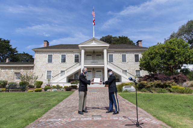Col. Greg Ford, Presidio of Monterey commander, presents Mayor Clyde Roberson, City of Monterey, with a Patriotic Public Service Award to the City of Monterey for 250 years of partnership on June 8 at the Colton Hall Museum.