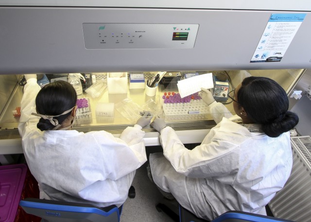 U.S. Air Force microbiology technicians with Landstuhl Regional Medical Center’s Department of Pathology and Area Laboratory Services, prepare patient samples for COVID-19 testing at LRMC, May 6.