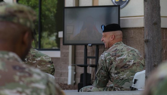 Brig. Gen. Johnny Davis laughs during Joint Modernization Command's change of command ceremony on June 15 in front of JMC headquarters on Fort Bliss, Texas. The ceremony was hosted virtually by Lt. Gen. Eric Wesley, deputy commanding general of U.S. Army Futures Command and director of the Futures and Concepts Center. Davis will now serve as chief of staff at Army Futures Command. (Photo by Cpl. William Dickinson)