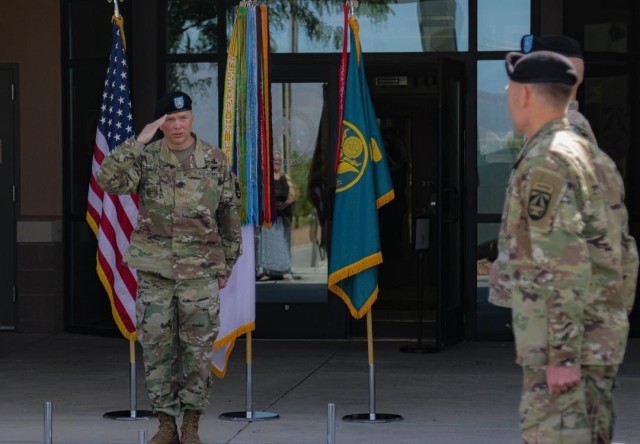 Command Sgt. Maj. Christopher Gunn, senior enlisted advisor at Joint Modernization Command, salutes JMC's new commander Col. Tobin Magsig during Joint Modernization Command's change of command ceremony on June 15 in front of JMC headquarters on Fort Bliss, Texas. (Photo by Cpl. William Dickinson)