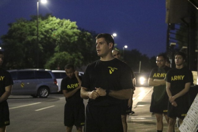 Sgt. Conner Owens, administrative assistant to the 1st Cavalry Division senior enlisted leader, Command Sgt. Maj. Thomas Kenny, briefs the division's weekly 5-mile PT challenge to all participating Soldiers at Cooper Field, 5 June. Every week,...