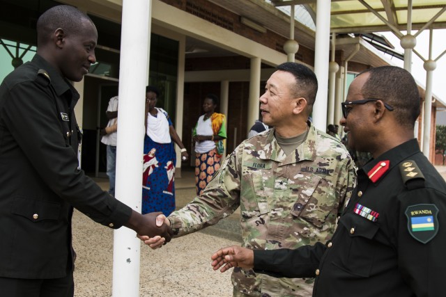 U.S. Army Brig. Gen. Lapthe Flora, deputy commanding general for U.S. Army Africa, greets a Rwandan Soldier during MEDRETE 18-5 at the Rwanda Military Hospital, Kigali, Rwanda, Aug. 20, 2018. MEDRETE 18-5 is the first combined effort for a medical readiness training exercise between the Rwandan government and U.S. Army Africa. The exercise is part of a series of medical readiness training that U.S. Army Africa is scheduled to facilitate within various countries in Africa, and serves as an opportunity for the partnered militaries to hone and strengthen their general surgery and trauma skills while reinforcing the partnership between the countries.
(U.S. Air Force photo by Tech. Sgt. Larry E. Reid Jr.)