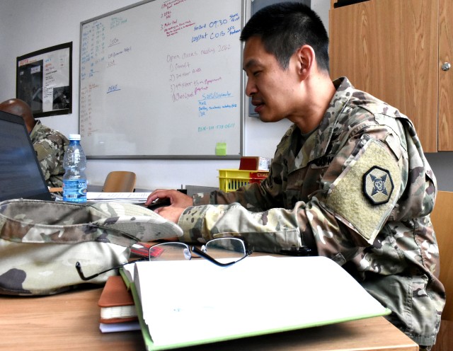 Sgt. 1st Class Than Munzke, a psychological operation senior non commissioned officer from Lakewood, Colorado is reviewing a letter of justification.  Munzke serves as a contracting officer representative at Bemowo Piskie Training Area in Bemowo...