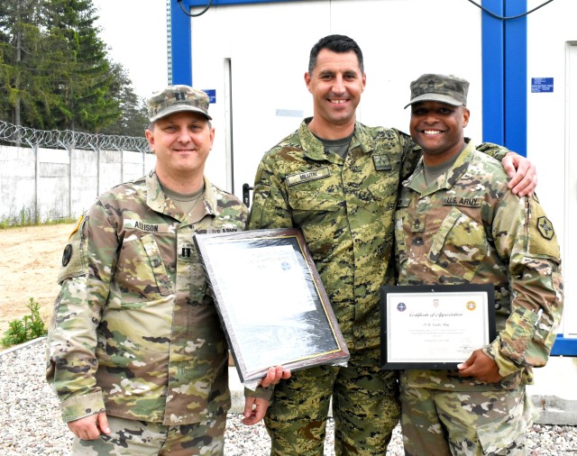Capt. Craig Allison, a logistics officer from Caldwell, Idaho and Sgt. 1st Class Curtis Ray, a food service senior non commissioned officer from Colorado Springs, Colorado recognized and were recognized by the representative from Croatian Army,...