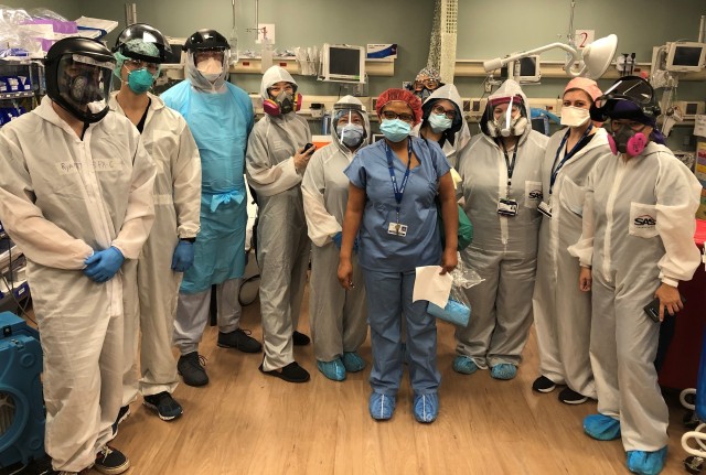 Capt. Chimdinma Barbara Ojini (center) pictured April 30, with other members of an Army Reserve Urban Augmentation Task Force serving at Elmhurst Hospital Center in New York City. Ojini, a nurse practitioner, is one of more than 1200 Army Reserve medical professionals that have mobilized as part of the Department of Defense response to COVID-19.