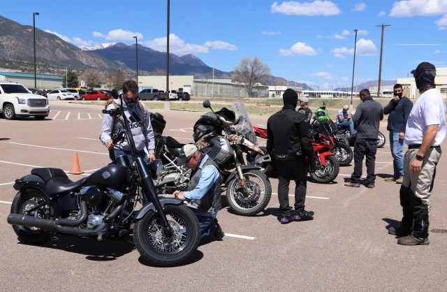 Leaders from 68th Combat Sustainment Support Battalion, 4th Sustainment Brigade, 4th Infantry Division inspect the motorcycles of Soldiers that participated in a brigade level mentorship ride May 1 in the 68th CSSB’s parking lot on Fort Carson, Colorado. The mentorship ride allows leaders the opportunity to see the skill level of their riders, inspect the personal protective equipment and help train new riders. (U.S. Army photo by Sgt. James Geelen, 4th Sustainment Brigade Public Affairs Office, 4th Infantry Division)