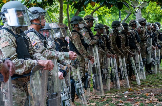 Military police from the D.C. National Guard stand with their shields at Lafayette Park, Washington, D.C., on June 2, 2020, awaiting instructions as they prepare to support local D.C. authorities.