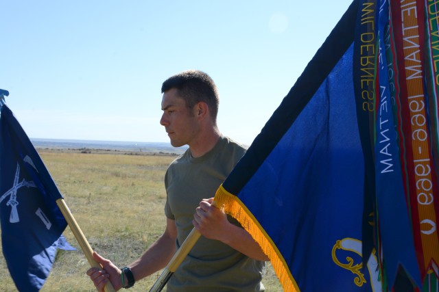 1st Lt. Tanner Ellison, executive officer of Delta (Dog) Company, 1st Battalion, 12th Infantry Regiment, 2nd Infantry Brigade Combat Team, 4th Infantry Division, bears his company and battalion guidons after completing the “112 for 1-12 Challenge” in memory of Pfc. Keith Williams April 28, 2020, at Fort Carson. (Photo by Sgt. Gabrielle Weaver)