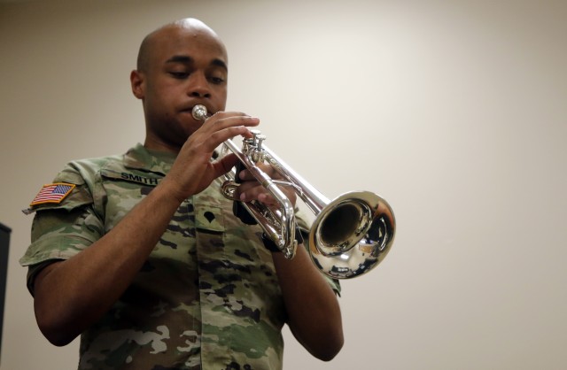 Spc. Nicholas Smith, a Soldier with the 10th Mountain Division band, plays the trumpet to warm up before a rehearsal on June 11, 2020, at the division band headquarters at Fort Drum, N.Y. Smith has been playing the trumpet for over 15 years. (U.S. Army photo by Pfc. Anastasia Rakowsky)