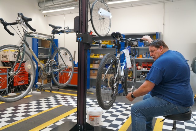 WIESBADEN, Germany - David Webster, maintenance mechanic at Wiesbaden Outdoor Recreation, works on a bicycle May 18, 2020, at the facility on Clay North. Additional online resources from the Outdoor Recreation and Education Program include a...