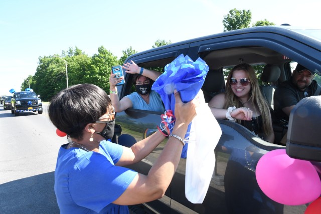 An outpouring of support stretched for miles as Fort Drum community members celebrated Class of 2020 graduates June 18 with a commencement parade. Dozens of high school seniors and their family members drove across post in vehicles decorated with...