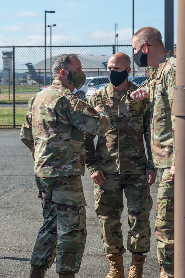 Chief Master Sgt. John Lipsey, 62nd Maintenance Group command chief, right, and Col. Aaron Sasson, 62nd Maintenance Group commander, center, greet Gen. David Goldfein, chief of staff of the Air Force, at Joint Base Lewis-McChord, Wash., June 18,...
