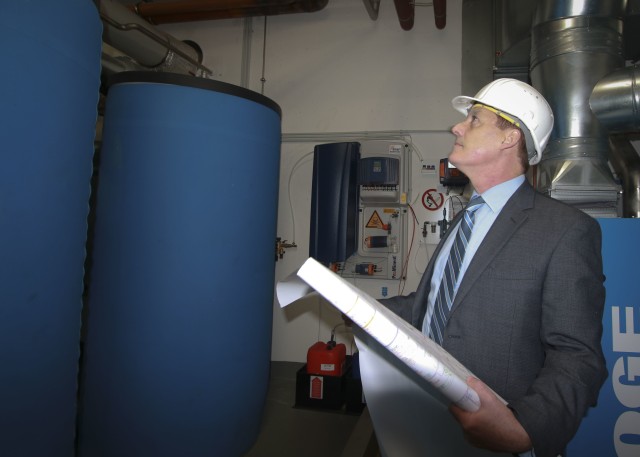 William McCarthy, facility director for Landstuhl Regional Medical Center and Regional Health Command Europe, checks blueprints for recently-installed water treatment equipment at LRMC. McCarthy, was recently recognized as the civilian of the year for 2019.
