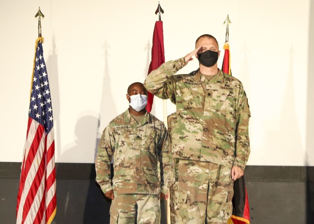 Lt. Col. James McWherter, incoming commander, Wiesbaden Army Health Clinic, presents a salute during a change of command ceremony where McWherter assumed command of Wiesbaden Army Health Clinic, June 12.