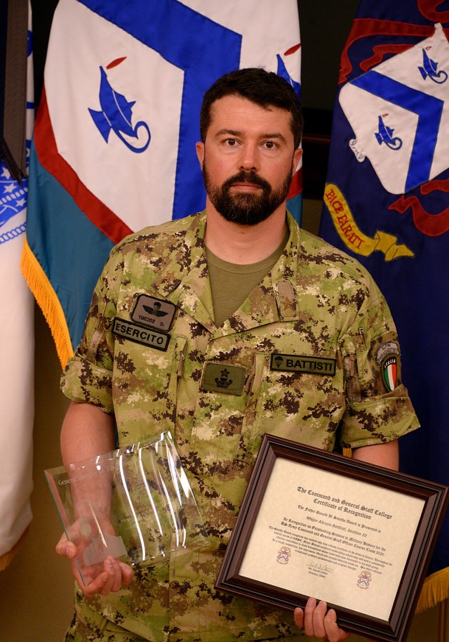 Italian Maj. Alessio Battisti is the 2020 recipient of the General Dwight D. Eisenhower Award, which recognizes the most distinguished international graduate of each Command and General Staff Officer Course class. CGSOC award recipients received their awards in a small ceremony June 11 in Marshall Lecture Hall at the Lewis and Clark Center. The 2020 CGSOC graduation and International Graduate Badge ceremonies were conducted virtually on Facebook and YouTube, with videos of pre-recorded speeches, photos of award recipients and names of graduates listed. Photo by Prudence Siebert/Fort Leavenworth Lamp