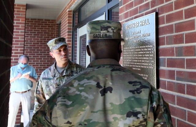 Col. Jason Williams, current commander of the 10th Mountain Division (LI) Artillery, and Command Sgt. Maj. Jimmy Sadler, 10th Mountain DIVARTY's senior enlisted leader, unveil a bronze plaque that signified the rededication of the DIVARTY Headquarters as Ruffner Hall, June 19, 2020 on Fort Drum, N.Y. Ruffner, who was at the time of his command of the unit a Brigadier General, led the Soldiers of 10th Mountain Division’s Artillery across the battlefields of Italy in WWII. (U.S. Army photo by Pfc. Anastasia Rakowsky)