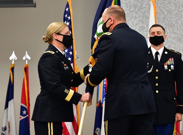 Brig. Gen. Heidi Hoyle, the Military Surface Deployment and Distribution Command's 22nd commanding general, takes the guidon from Gen. Stephen Lyons, commander of U.S. Transportation Command June 23, 2020 during a change of command ceremony at...