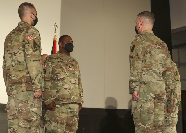 Sgt. 1st Class Timothy Johnson (second from left), detachment sergeant, Wiesbaden Army Health Clinic, prepares to relinquish his responsibilities as the WAHC detachment sergeant during a change of command and responsibility ceremony, June 12.