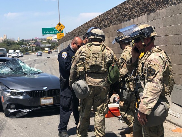 Cal National Guard Soldiers assist car wreck victim